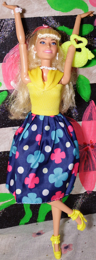Barbie in Warm Dresses Yellow and Leopard Print Photos