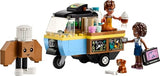 LEGO Friends Mobile Bakery Food Cart Playset, Cooking Toy for Pretend Play, Small Gift for Kids, Girls and Boys Ages 6 and Up with Aliya and Jules Mini-Dolls, Aira Dog Figure and Food Toys, 42606