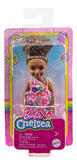 Barbie Chelsea Doll (Brunette Curly Hair) Wearing One-Shoulder Flower-Print Dress and Pink Shoes, Toy for Kids Ages 3 Years Old & Up