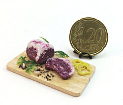 Fresh meat on the board, beef steak. Dollhouse miniature 1:12