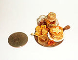 Dollhouse miniature Honey fritters with honey and bananas, jars of honey 1:12