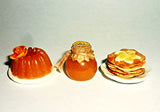 Honeymoon kit. Pudding, pancakes with bananas, honey. Dollhouse miniature 1:12