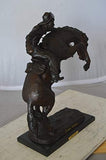 Wooly Chaps Bronze Statue by Remington - Size: 19" L x 11" W x 23" H.