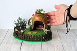 Miniature fairy garden house in tea cup room inside. Led light handmade