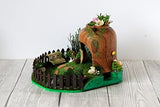 Miniature fairy garden house in tea cup room inside. Led light handmade