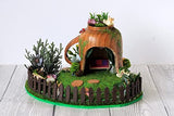 Miniature fairy garden house in tea cup room inside. Led light handmade