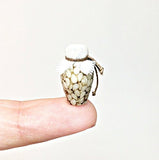 Bottle of Pickled garlic. Dollhouse miniature 1:12