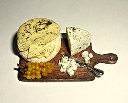 Cheese on the board bunch of grapes. Dollhouse miniature 1:12