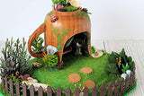 Miniature fairy garden house in tea cup room inside. Led light handmade