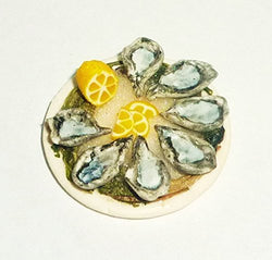Dish with seafood, oysters, lemon, ice algae. Dollhouse miniature 1:12