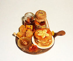 Dollhouse miniature Honey fritters with honey and bananas, jars of honey 1:12