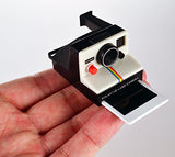 Worlds Smallest Bundle Rubik's Cube, Polaroid Camera, and Etch a Sketch