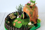 Miniature fairy garden house in tea cup room inside. Led light handmade