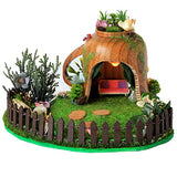 Miniature fairy garden house in tea cup room inside. Led light handmade