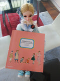 reference book,artsy sister,doll